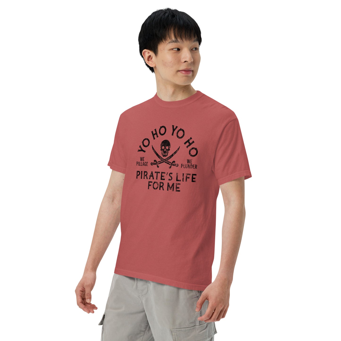 Person wearing a red t-shirt with black text and graphics on a white background