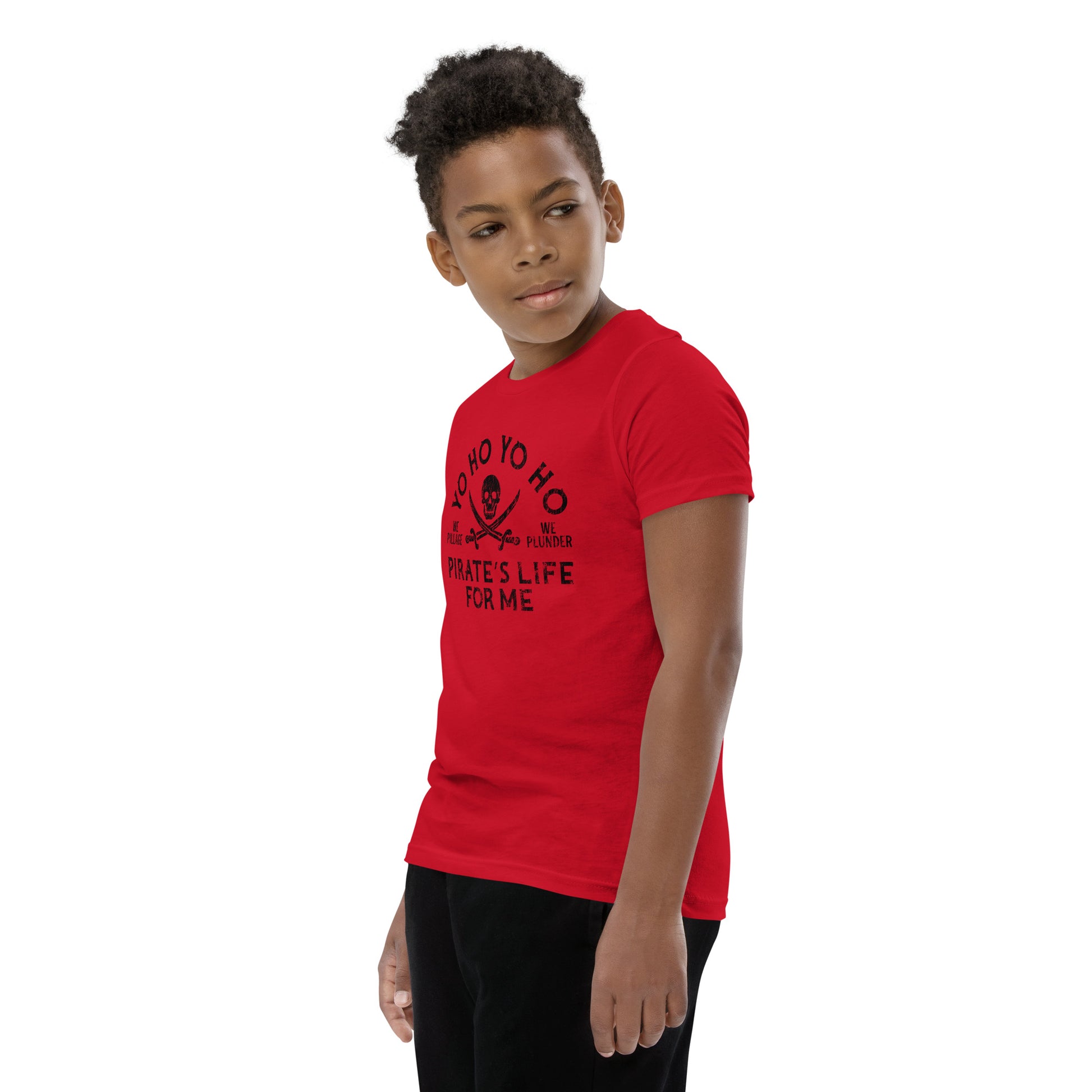 Child wearing a red t-shirt with a pirate design on a white background